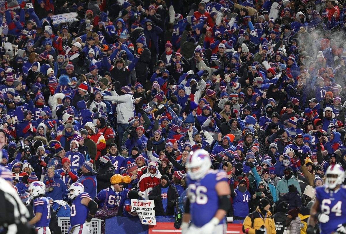 Bills fans cheer and throw snow in the air after QB Josh Allen scores a touchdown during the first half of the Bills divisional game against Kansas City Chiefs at Highmark Stadium in Orchard Park on Jan. 21, 2024.