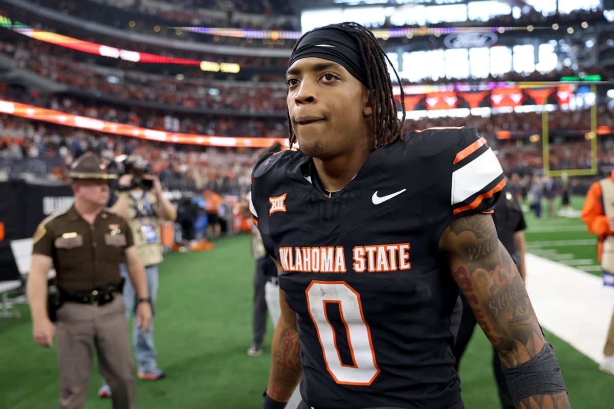 Oklahoma State's Ollie Gordon II (0) walks of the field following the Big 12 Football Championship game between the Oklahoma State University Cowboys and the Texas Longhorns at the AT&T Stadium in Arlington, Texas, Saturday, Dec. 2, 2023.