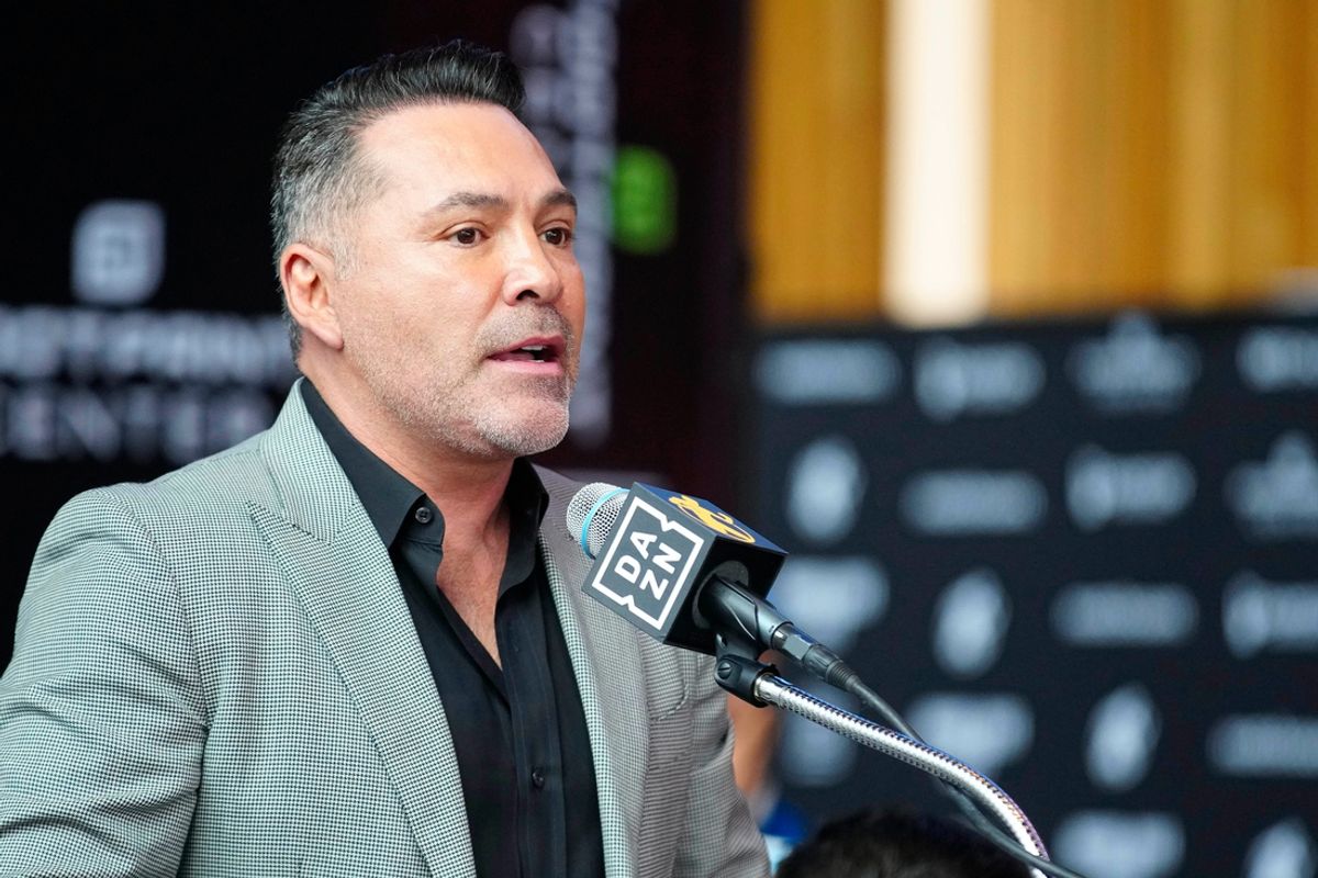 Jan. 25, 2024; Phoenix, Ariz; USA; Oscar De La Hoya speaks about boxer Jamie Munguia (center) about the Munguia v Ryder main event during a press conference for Golden Boy boxing event.