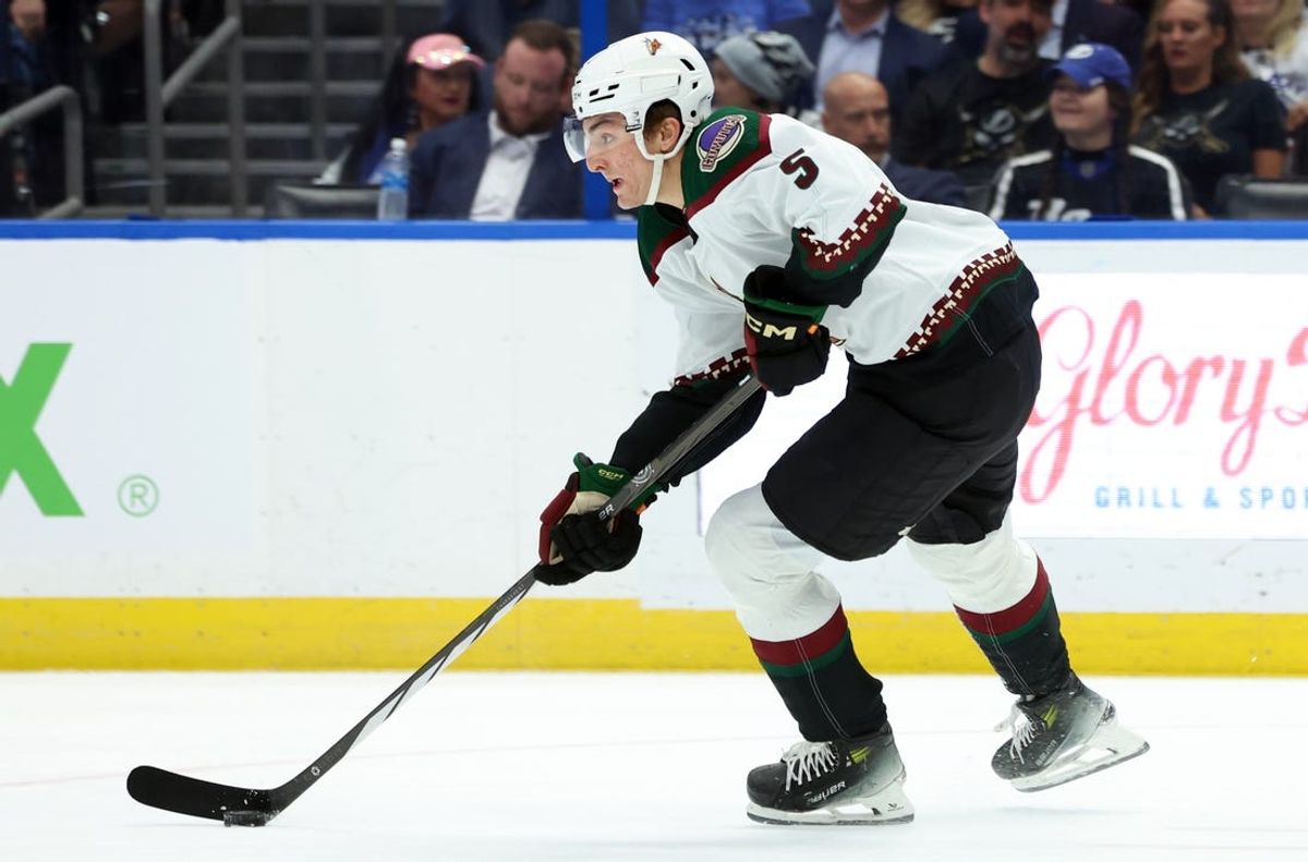 Jan 25, 2024; Tampa, Florida, USA; Arizona Coyotes defenseman Michael Kesselring (5) skates with the puck against the Tampa Bay Lightning during the first period at Amalie Arena. Mandatory Credit: Kim Klement Neitzel-USA TODAY Sports