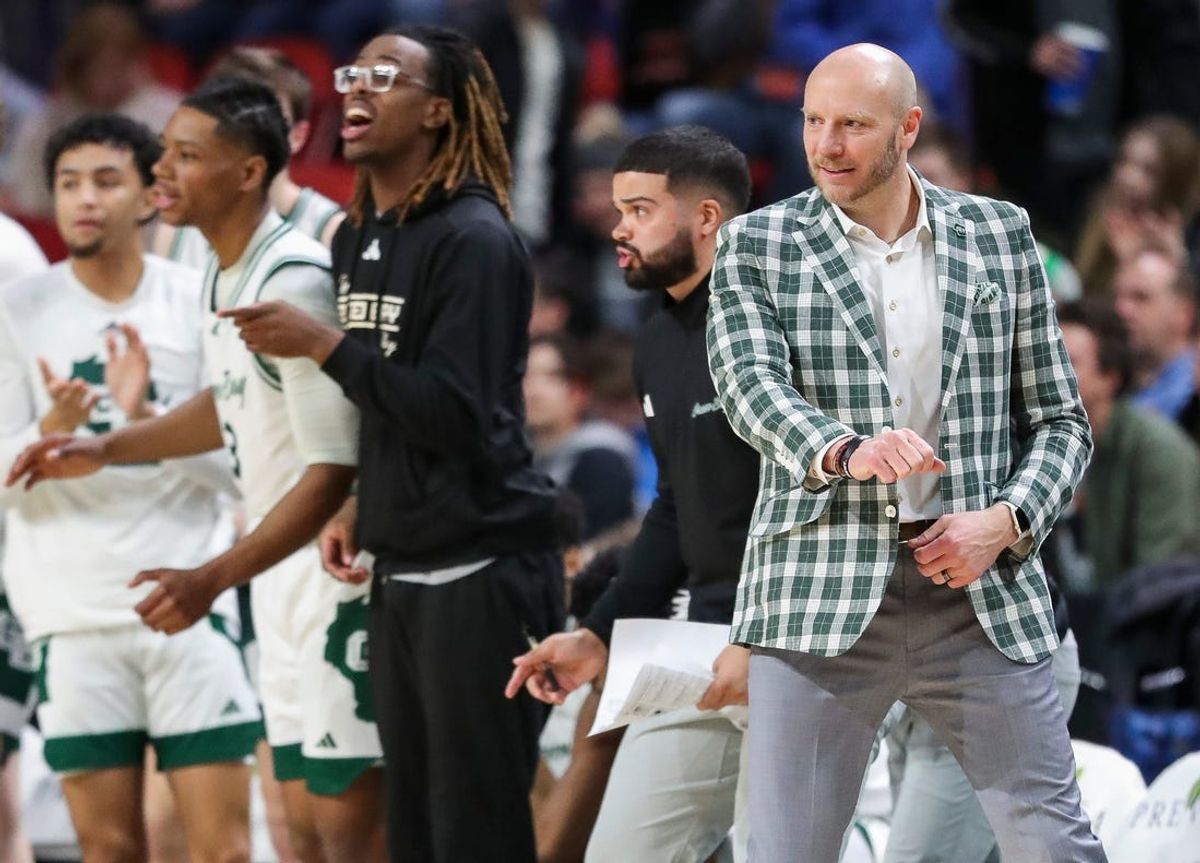 UWGB head coach Sundance Wicks pumps his fist after a made basket against Oakland University on Thursday, January 25, 2024, at the Resch Center in Green Bay, Wis. UWGB won the game, 69-59, to move into first place in the Horizon League.
Tork Mason/USA TODAY NETWORK-Wisconsin