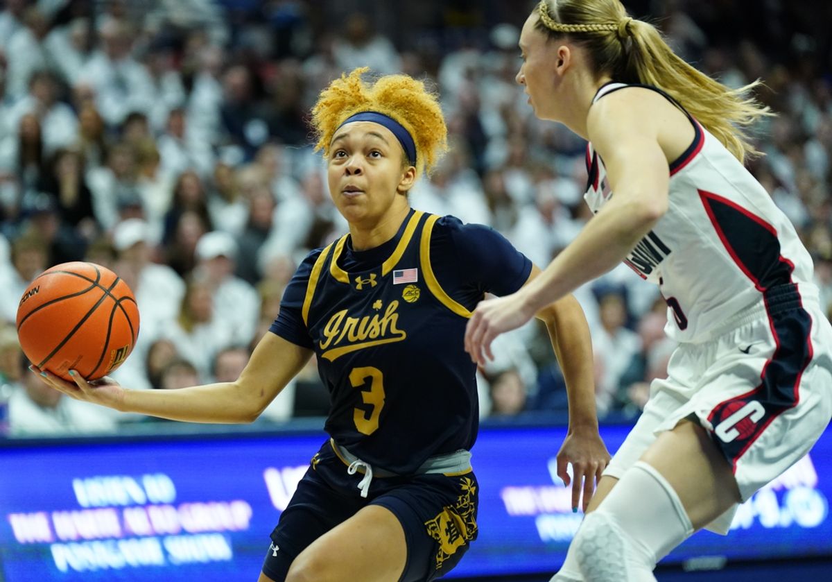 Jan 27, 2024; Storrs, Connecticut, USA; Notre Dame Fighting Irish guard Hannah Hidalgo (3) drives the ball against UConn Huskies guard Paige Bueckers (5) in the first half at Harry A. Gampel Pavilion. Mandatory Credit: David Butler II-Imagn Images