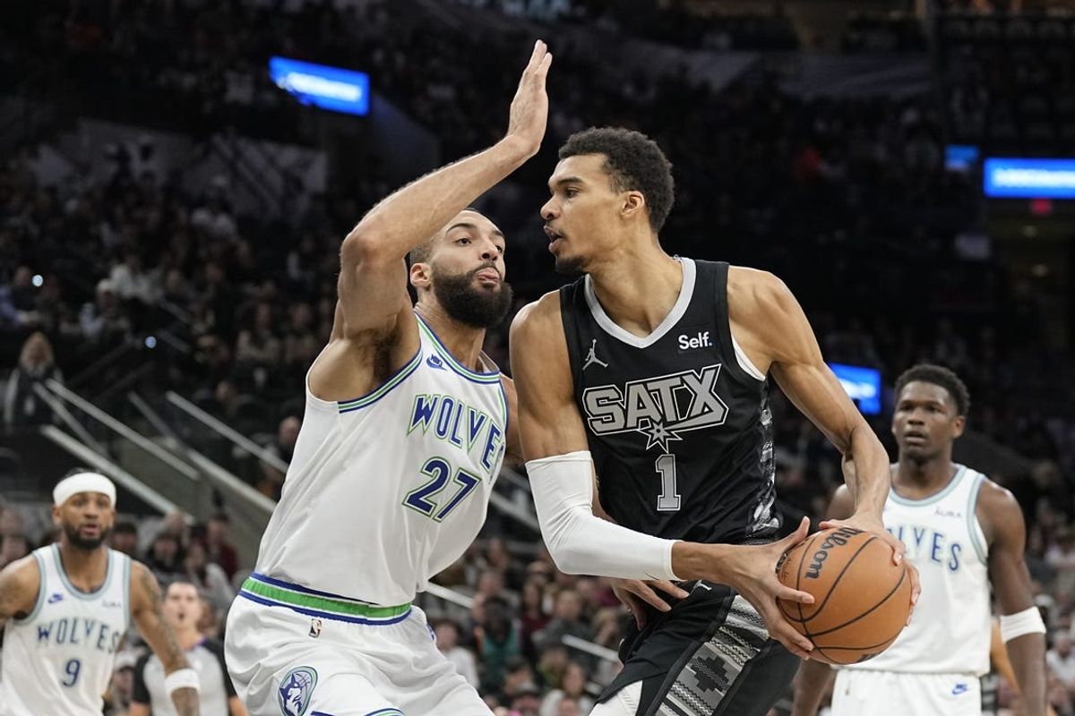 Jan 27, 2024; San Antonio, Texas, USA; San Antonio Spurs forward Victor Wembanyama (1) drives to the basket against the Minnesota Timberwolves center Rudy Gobert (27) during the first half at Frost Bank Center. Mandatory Credit: Scott Wachter-USA TODAY Sports