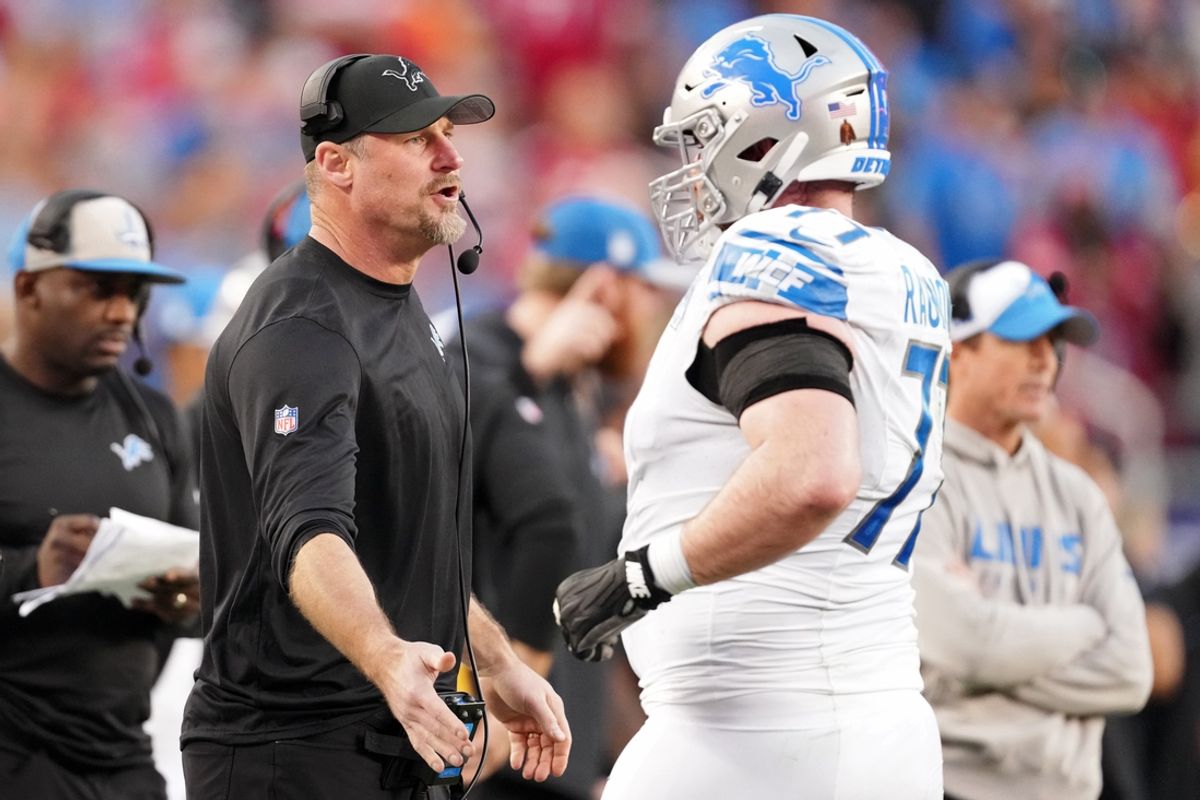 Jan 28, 2024; Santa Clara, California, USA; Detroit Lions head coach Dan Campbell high fives center Frank Ragnow (77) after a play against the San Francisco 49ers during the first half of the NFC Championship football game at Levi's Stadium. Mandatory Credit: Kyle Terada-Imagn Images