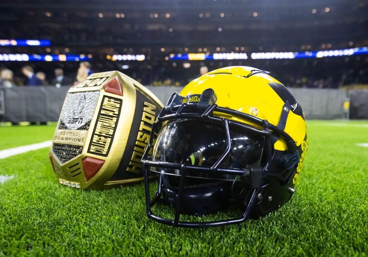 Jan 8, 2024; Houston, TX, USA; Detailed view of a Michigan Wolverines helmet and an oversized championship ring after defeating the Washington Huskies during the 2024 College Football Playoff national championship game at NRG Stadium. Mandatory Credit: Mark J. Rebilas-USA TODAY Sports