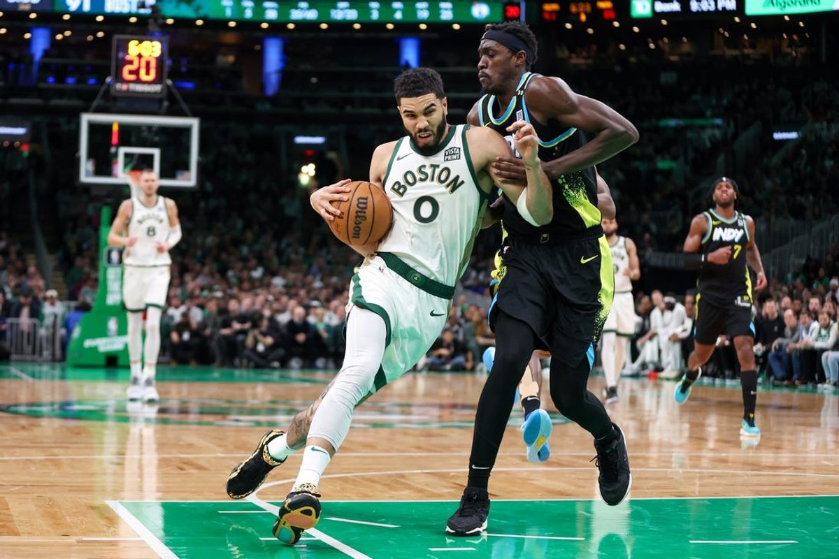 Jan 30, 2024; Boston, Massachusetts, USA; Boston Celtics forward Jayson Tatum (0) drives to the basket defended by Indiana Pacers forward Pascal Siakam (43) during the second half at TD Garden. Mandatory Credit: Paul Rutherford-USA TODAY Sports