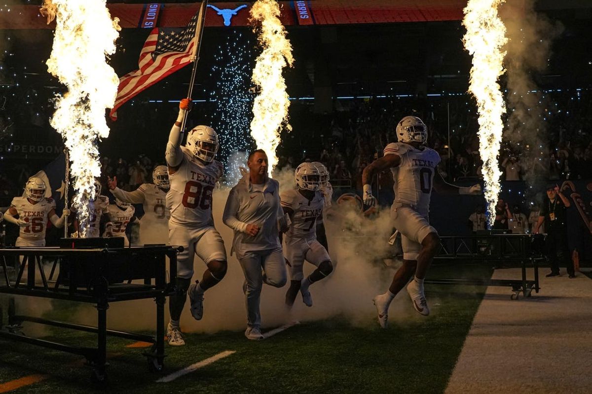 Texas Longhorns head coach Steve Sarkisian leads his team onto the field for the Sugar Bowl College Football Playoff  semifinals game against the Washington Huskies at the Caesars Superdome on Monday, Jan. 1, 2024 in New Orleans, Louisiana.