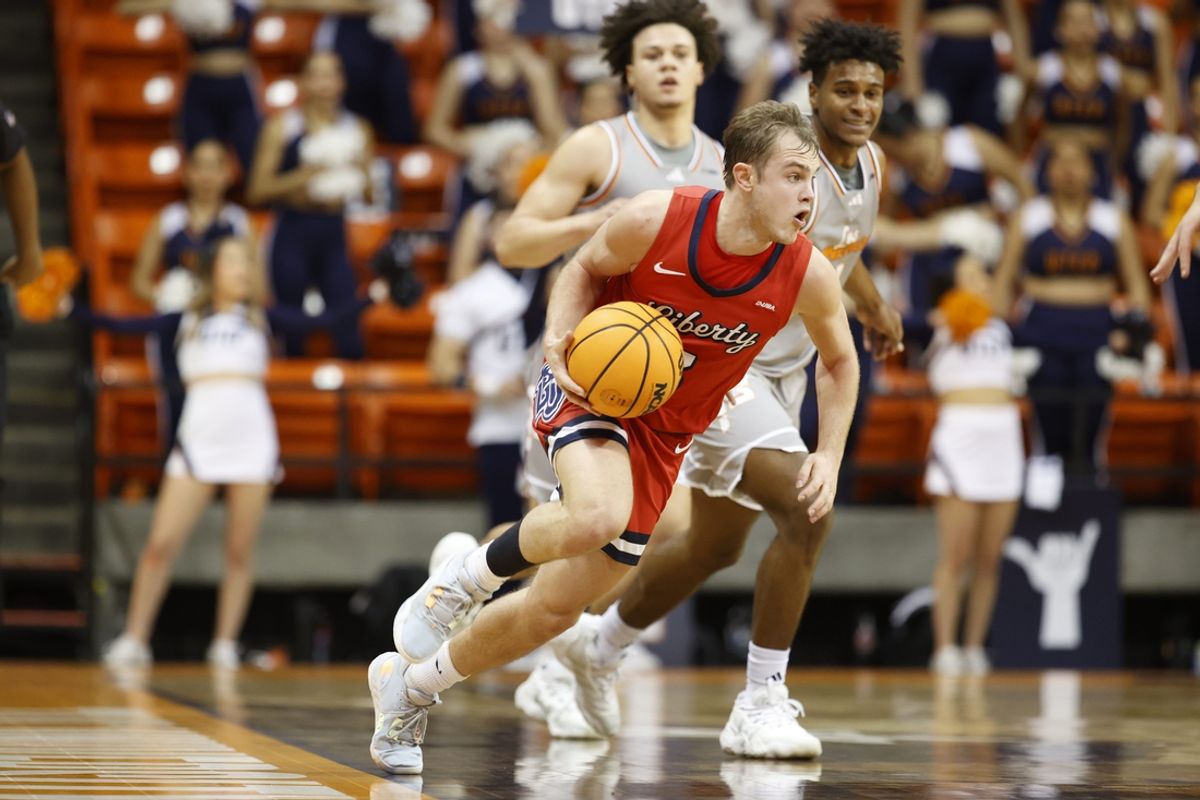 Feb 3, 2024; El Paso, Texas, USA; Liberty University Flames guard Kaden Metheny (3) dribbles the ball against the UTEP Miners defense in the first half at Don Haskins Center. Mandatory Credit: Ivan Pierre Aguirre-Imagn Images