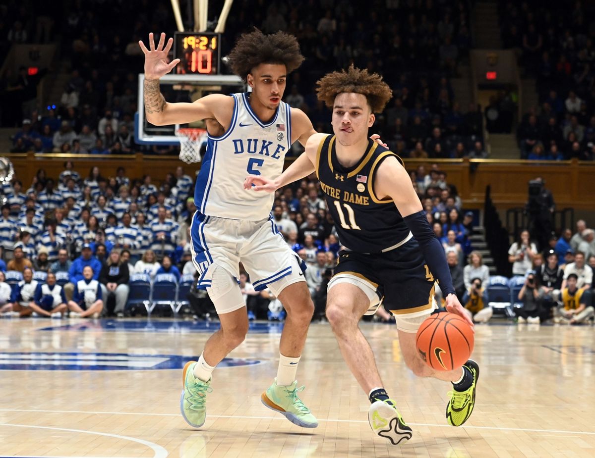 Feb 7, 2024; Durham, North Carolina, USA;  Notre Dame Fighting Irish guard Braeden Shrewsbury (11) drives to the basket as Duke Blue Devils guard Tyrese Proctor (5) defends during the first half at Cameron Indoor Stadium. Mandatory Credit: Rob Kinnan-Imagn Images