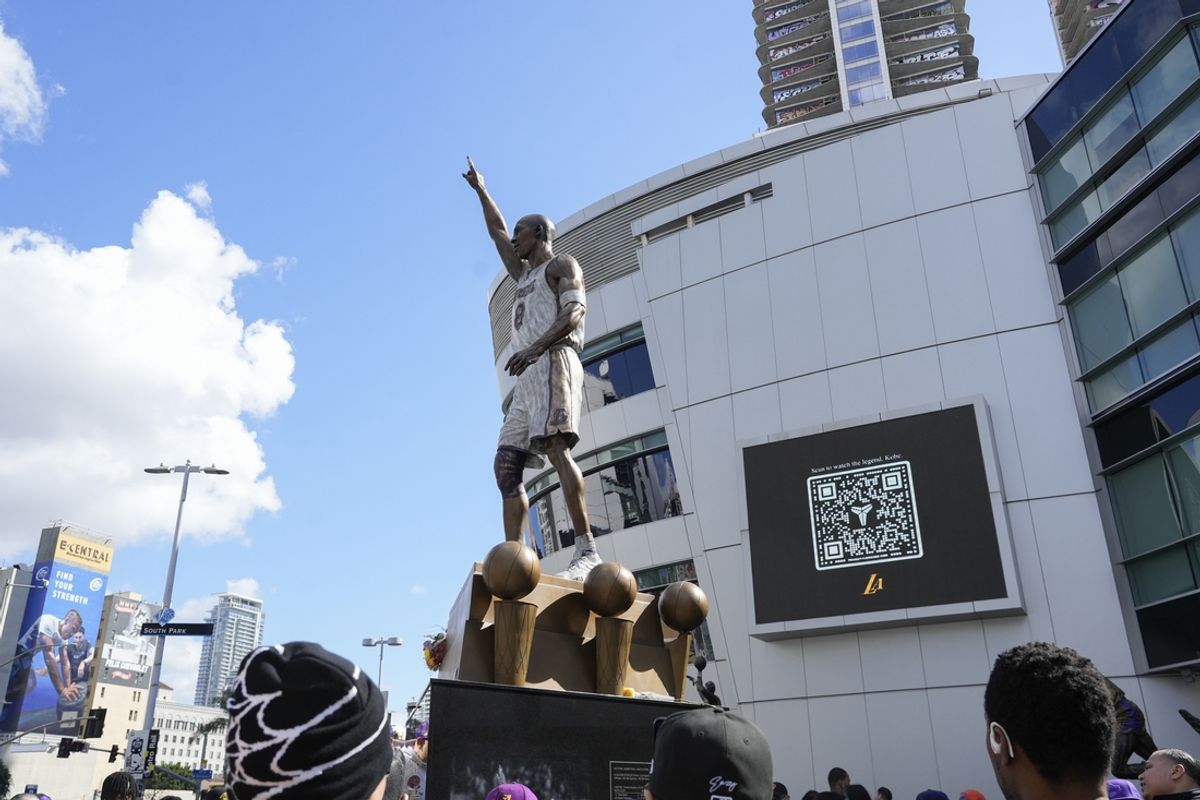 Feb. 9, 2024; Los Angeles, Calif.; The Los Angeles Lakers unveil a statue to the public honoring Hall of Famer Kobe Bryant at Crypto.com Arena. Bryant won five NBA championships and played all twenty of his NBA seasons with the franchise. Bryant died in a helicopter crash with his daughter Gianna in January 2020. Mandatory Credit: Sandy Hooper-USA TODAY