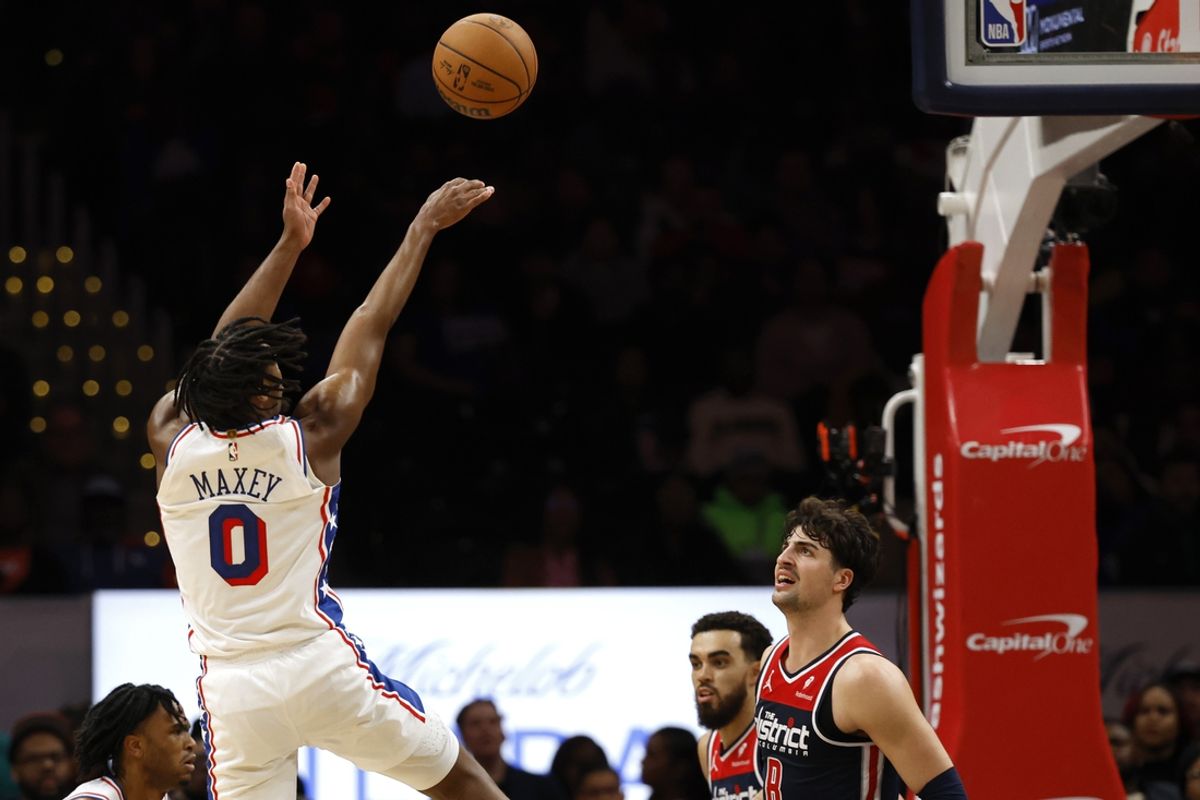 Feb 10, 2024; Washington, District of Columbia, USA; Philadelphia 76ers guard Tyrese Maxey (0) shoots the ball as Washington Wizards forward Deni Avdija (8) looks on in the second half at Capital One Arena. Mandatory Credit: Geoff Burke-Imagn Images