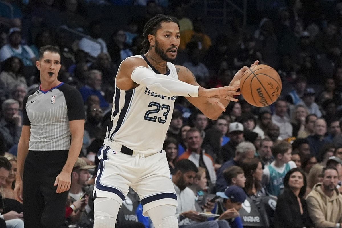 Feb 10, 2024; Charlotte, North Carolina, USA; Memphis Grizzlies guard Derrick Rose (23) passes during the second half against the Charlotte Hornets at Spectrum Center. Mandatory Credit: Jim Dedmon-Imagn Images