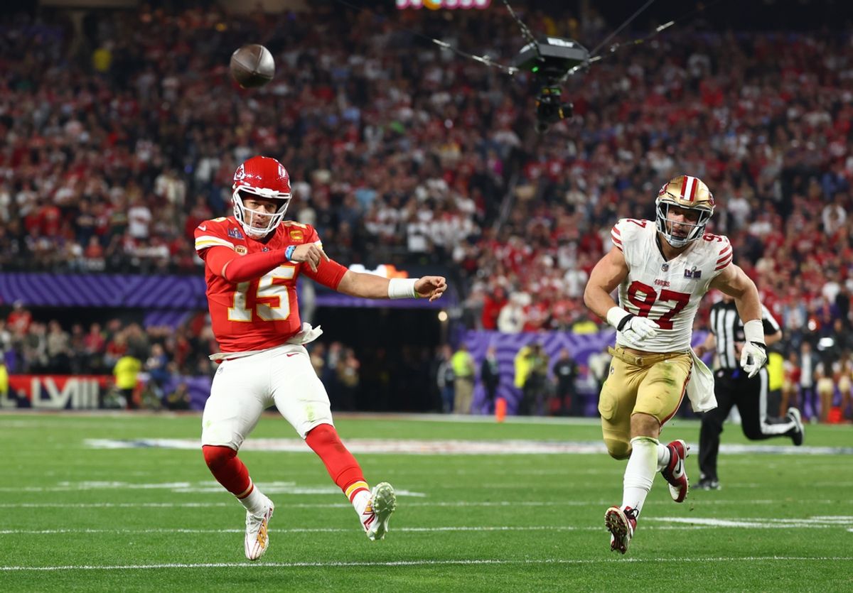 Kansas City Chiefs quarterback Patrick Mahomes (15) throws a pass as San Francisco 49ers defensive end Nick Bosa (97) gives chase in the fourth quarter of Super Bowl LVIII. Mandatory Credit: Mark J. Rebilas-Imagn Images