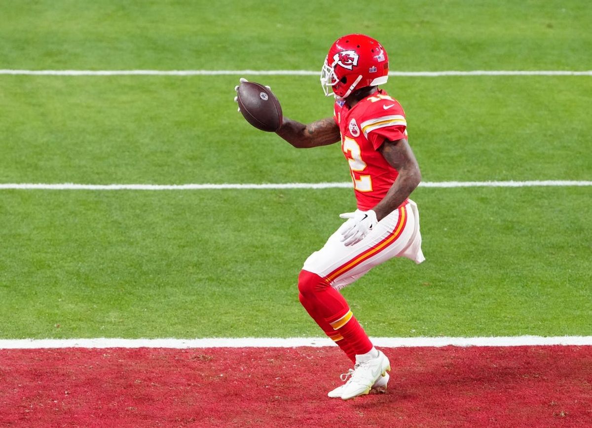 Feb 11, 2024; Paradise, Nevada, USA;  Kansas City Chiefs wide receiver Mecole Hardman Jr. (12) scores the winning touchdown against the San Francisco 49ers during overtime in Super Bowl LVIII at Allegiant Stadium. Mandatory Credit: Stephen R. Sylvanie-USA TODAY Sports