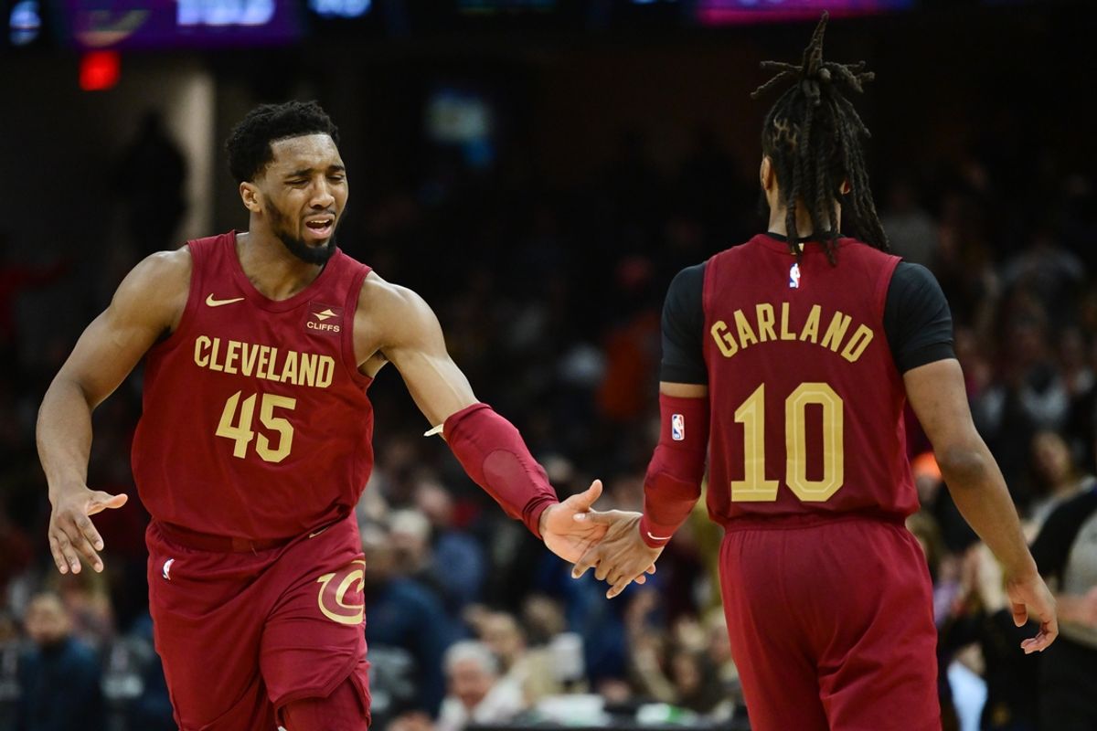 Feb 14, 2024; Cleveland, Ohio, USA; Cleveland Cavaliers guard Donovan Mitchell (45) celebrates with guard Darius Garland (10) during the second half against the Chicago Bulls at Rocket Mortgage FieldHouse. Mandatory Credit: Ken Blaze-Imagn Images