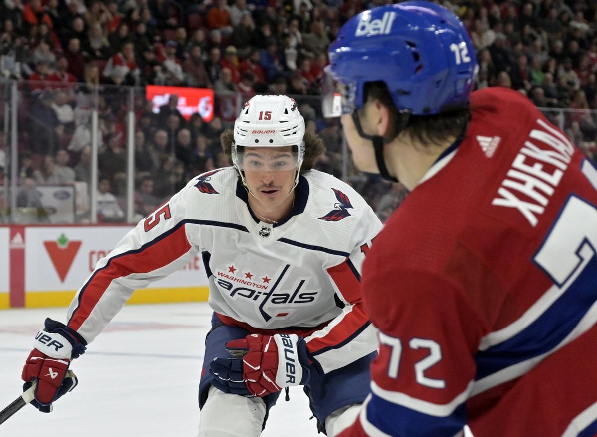 Feb 17, 2024; Montreal, Quebec, CAN; Washington Capitals forward Sonny Milano (15) forechecks on Montreal Canadiens defenseman Arber Xhekaj (72) during the third period at the Bell Centre. Mandatory Credit: Eric Bolte-Imagn Images