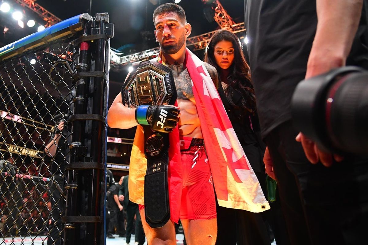 Feb 17, 2024; Anaheim, California, USA; Ilia Topuria celebrates his championship victory against Alexander Volkanovski during UFC 298 at Honda Center. Mandatory Credit: Gary A. Vasquez-Imagn Images