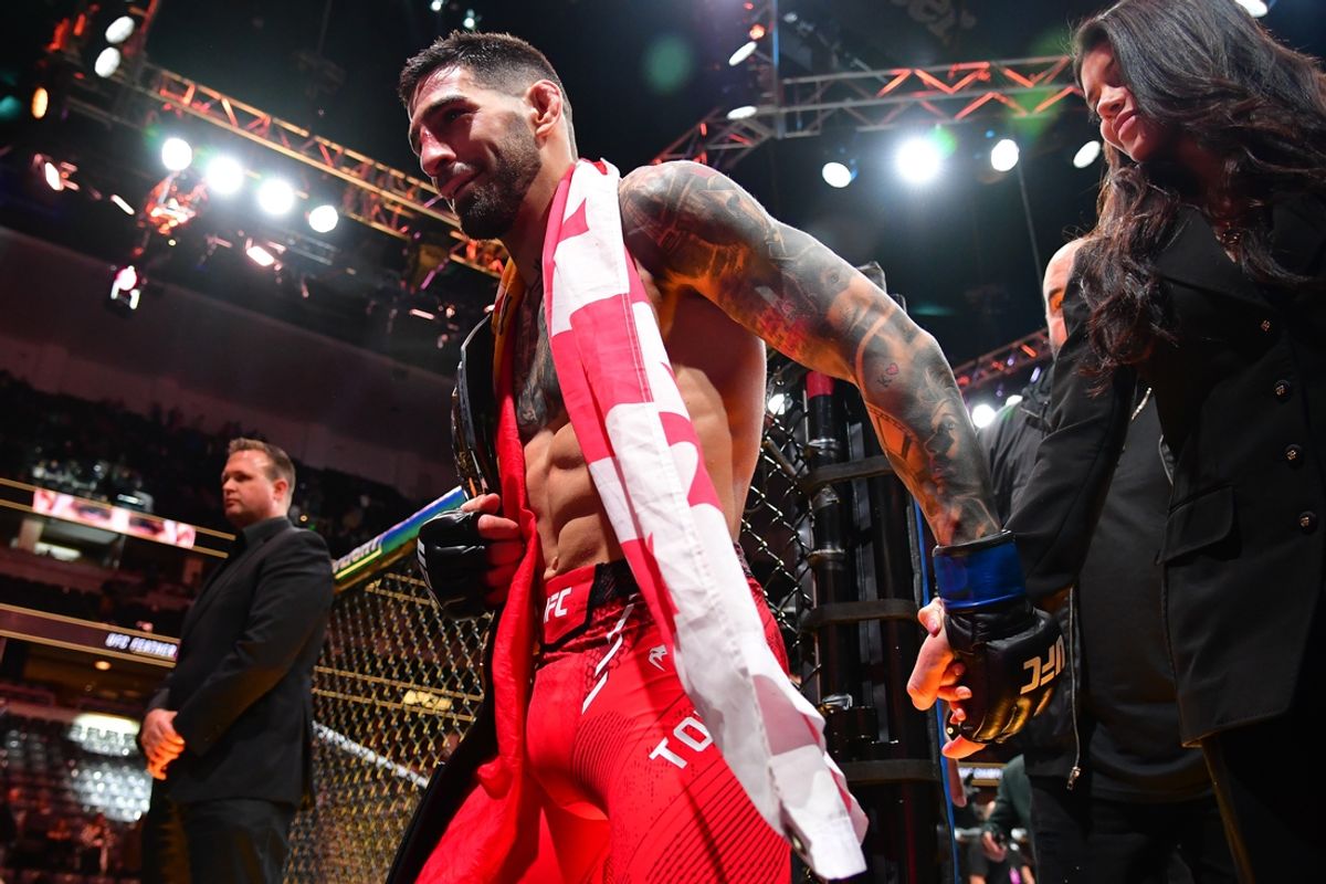 Feb 17, 2024; Anaheim, California, USA; Ilia Topuria celebrates his championship victory against Alexander Volkanovski during UFC 298 at Honda Center. Mandatory Credit: Gary A. Vasquez-Imagn Images