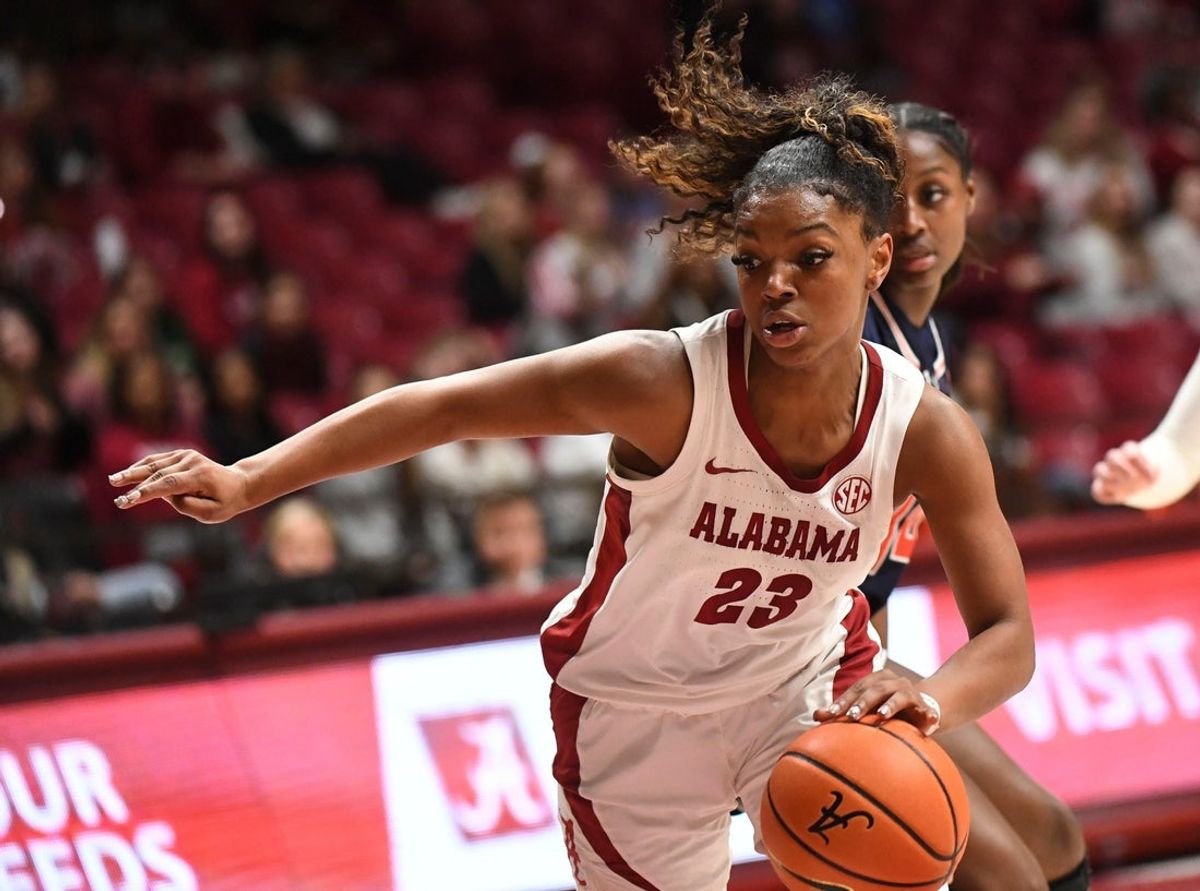 Feb 18, 2024; Tuscaloosa, Alabama, USA; Alabama guard Jessica Timmons (23) makes a cut to the basket against Auburn at Coleman Coliseum Sunday. Alabama came back from a double-digit deficit to defeat Auburn 67-61.