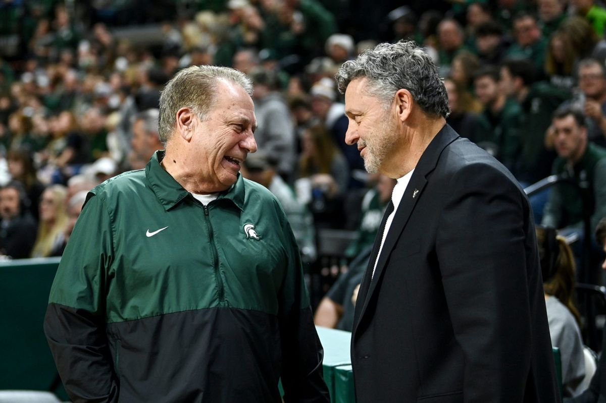 Michigan State's head coach Tom Izzo, left, talks with Oakland's head coach Greg Kampe before the game on Monday, Dec. 18, 2023, at the Breslin Center in East Lansing. \"They get their players going, the level of intensity just ratchets up and there's nothing you can do about it as a visiting player or team,\" Said Kampe of the Izzone impact.
