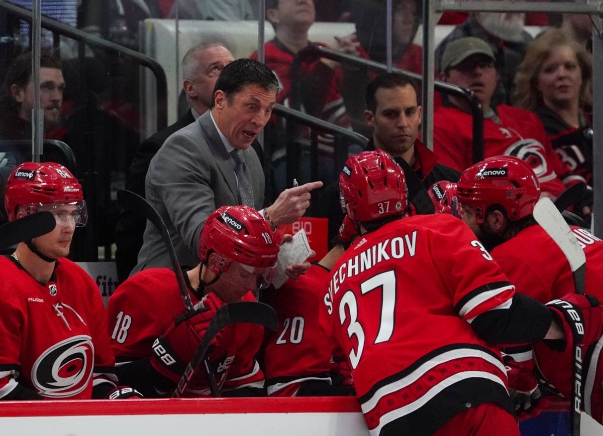 Feb 24, 2024; Raleigh, North Carolina, USA;  Carolina Hurricanes head coach Rod Brind   Amour talks to right wing Andrei Svechnikov (37) and defenseman Brent Burns (8) during the second period at PNC Arena. Mandatory Credit: James Guillory-Imagn Images