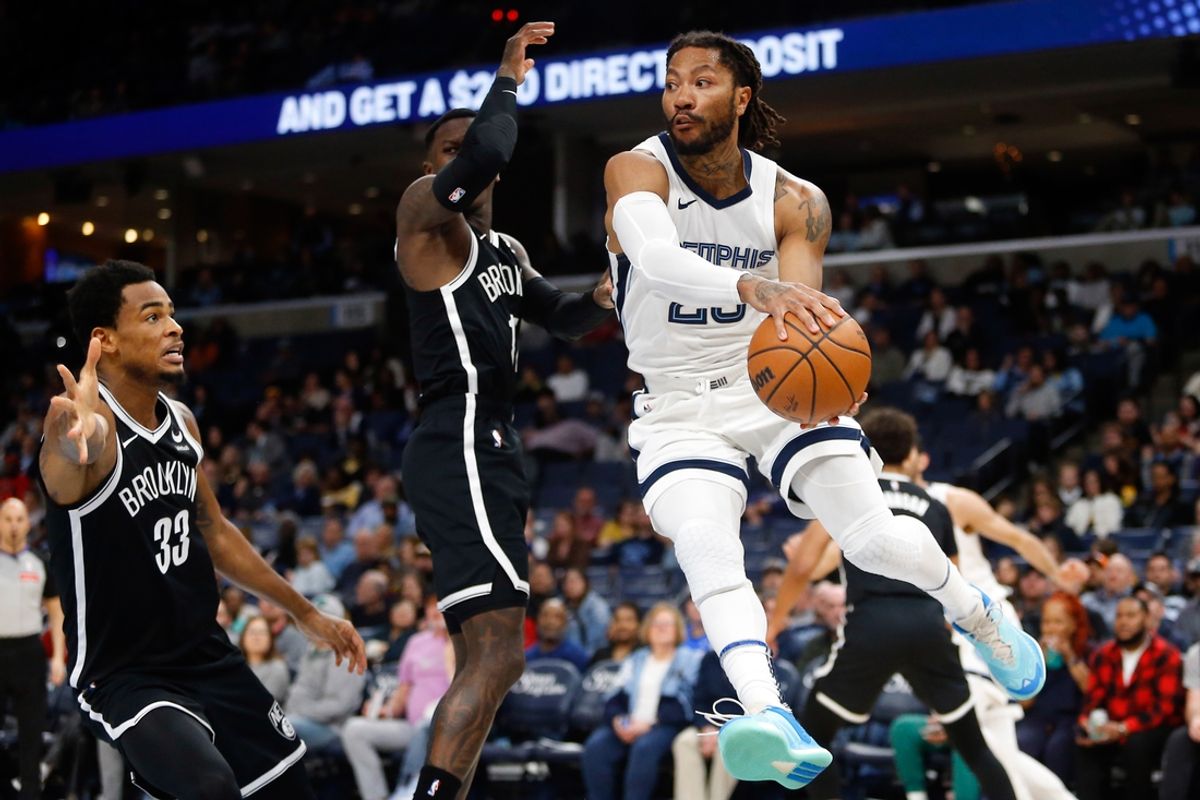 Feb 26, 2024; Memphis, Tennessee, USA; Memphis Grizzlies guard Derrick Rose (23) passes the ball during the first half against the Brooklyn Nets at FedExForum. Mandatory Credit: Petre Thomas-Imagn Images