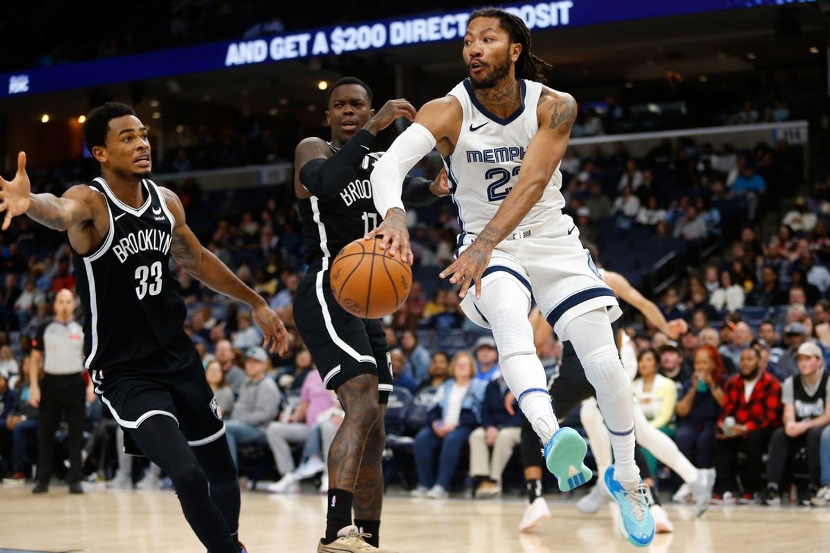 Feb 26, 2024; Memphis, Tennessee, USA; Memphis Grizzlies guard Derrick Rose (23) passes the ball during the first half against the Brooklyn Nets at FedExForum. Mandatory Credit: Petre Thomas-Imagn Images