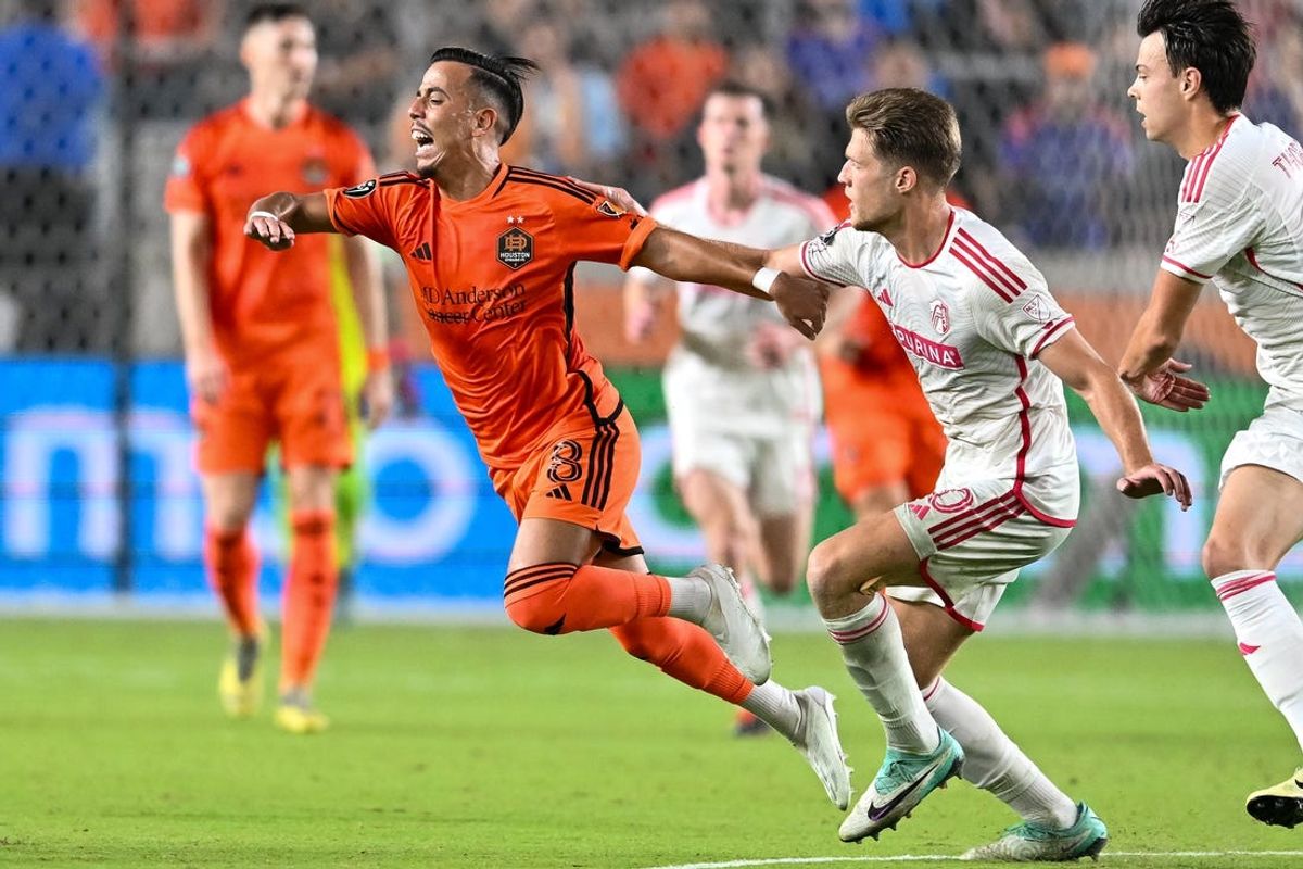 Feb 27, 2024; Houston, TX, USA; St. Louis CITY SC defender Michael Wentzel (40) defends as Houston Dynamo FC midfielder Amine Bassi (8) trips during the second half at Shell Energy Stadium. Mandatory Credit: Maria Lysaker-USA TODAY Sports
