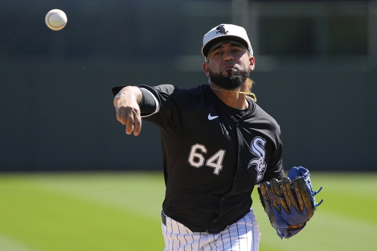 Feb 28, 2024; Phoenix, Arizona, USA; Chicago White Sox relief pitcher Deivi Garcia (64) throws against the San Diego Padres in the first inning at Camelback Ranch-Glendale. Mandatory Credit: Rick Scuteri-Imagn Images