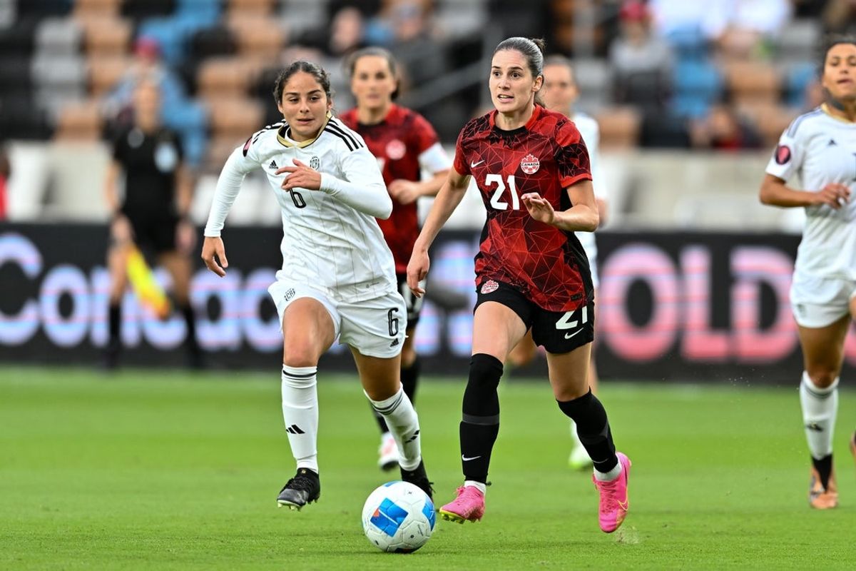 Feb 28, 2024; Houston, Texas, USA; Canada midfielder Clarissa Larisey (21) looks to pass the ball during the first half as Costa Rica midfielder Emily Flores (6) defends at Shell Energy Stadium. Mandatory Credit: Maria Lysaker-Imagn Images