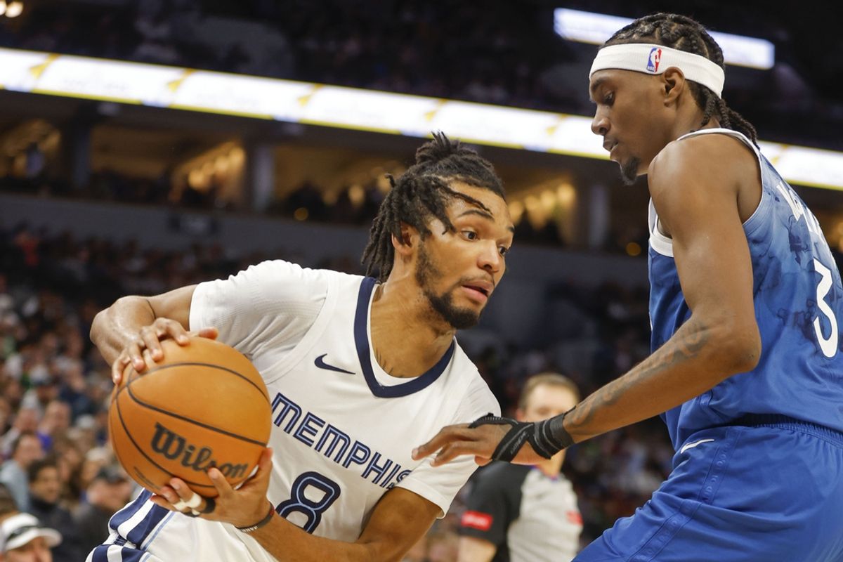 Feb 28, 2024; Minneapolis, Minnesota, USA; Memphis Grizzlies forward Ziaire Williams (8) works around Minnesota Timberwolves forward Jaden McDaniels (3) in the third quarter at Target Center. Mandatory Credit: Bruce Kluckhohn-USA TODAY Sports
