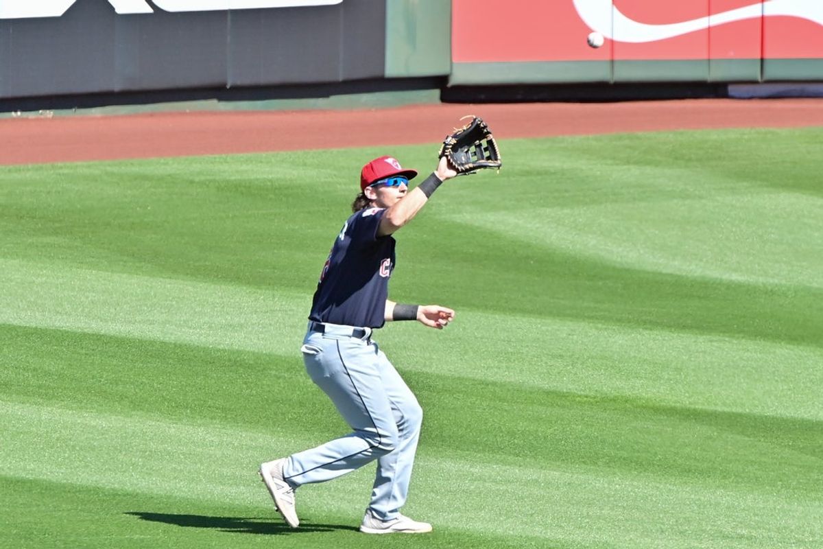 Feb 29, 2024; Tempe, Arizona, USA;  Cleveland Guardians right fielder Chase DeLauter (6) catches a fly ball in the third inning against the Los Angeles Angels during a spring training game at Tempe Diablo Stadium. Mandatory Credit: Matt Kartozian-Imagn Images