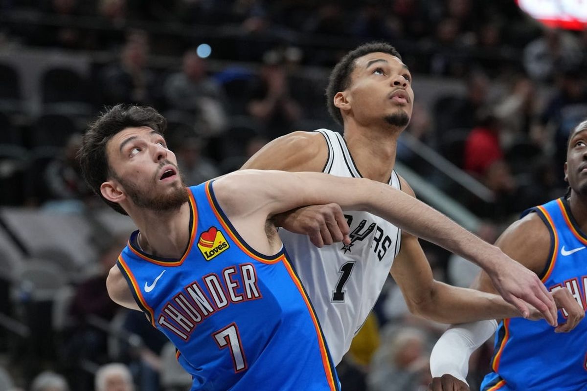 Feb 29, 2024; San Antonio, Texas, USA;  Oklahoma City Thunder forward Chet Holmgren (7) and San Antonio Spurs center Victor Wembanyama (1) battle for position in the first half at Frost Bank Center. Mandatory Credit: Daniel Dunn-USA TODAY Sports