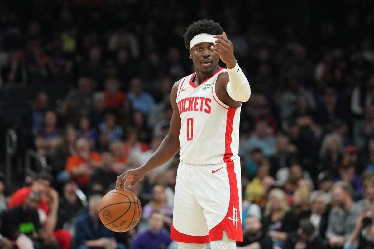 Feb 29, 2024; Phoenix, Arizona, USA; Houston Rockets guard Aaron Holiday (0) dribbles against the Phoenix Suns during the first half at Footprint Center. Mandatory Credit: Joe Camporeale-USA TODAY Sports