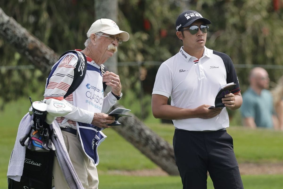 Mar 1, 2024; Palm Beach Gardens, Florida, USA;  C.T. Pan, right, and his caddie Mike “Fluff” Cowan look over the 10th green  during the second round of the Cognizant Classic in The Palm Beaches golf tournament. Mandatory Credit: Reinhold Matay-USA TODAY Sports