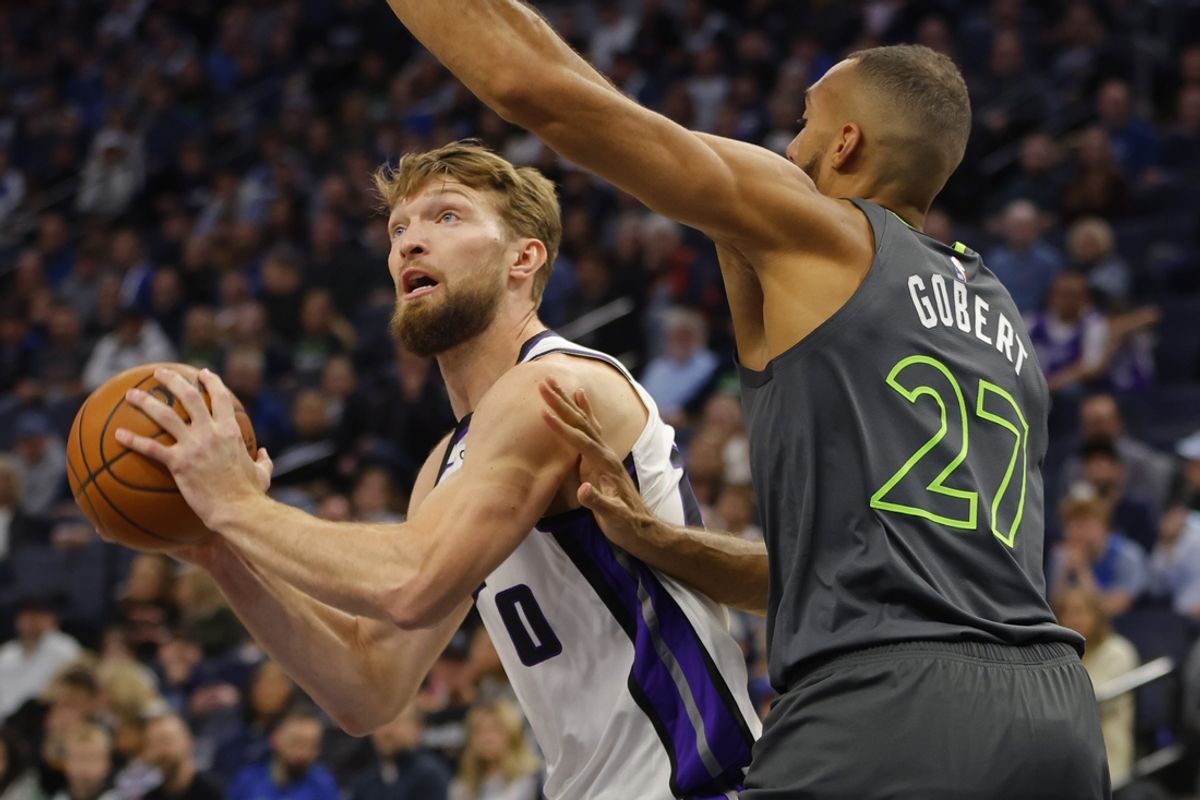 Mar 1, 2024; Minneapolis, Minnesota, USA; Sacramento Kings center Domantas Sabonis (10) works around Minnesota Timberwolves center Rudy Gobert (27) in the first quarter at Target Center. Mandatory Credit: Bruce Kluckhohn-Imagn Images