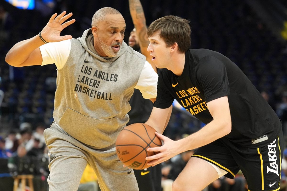 Jan 27, 2024; San Francisco, California, USA; Los Angeles Lakers assistant coach Phil Handy (left) works with guard Austin Reaves (right) before the game against the Golden State Warriors at Chase Center. Mandatory Credit: Darren Yamashita-Imagn Images