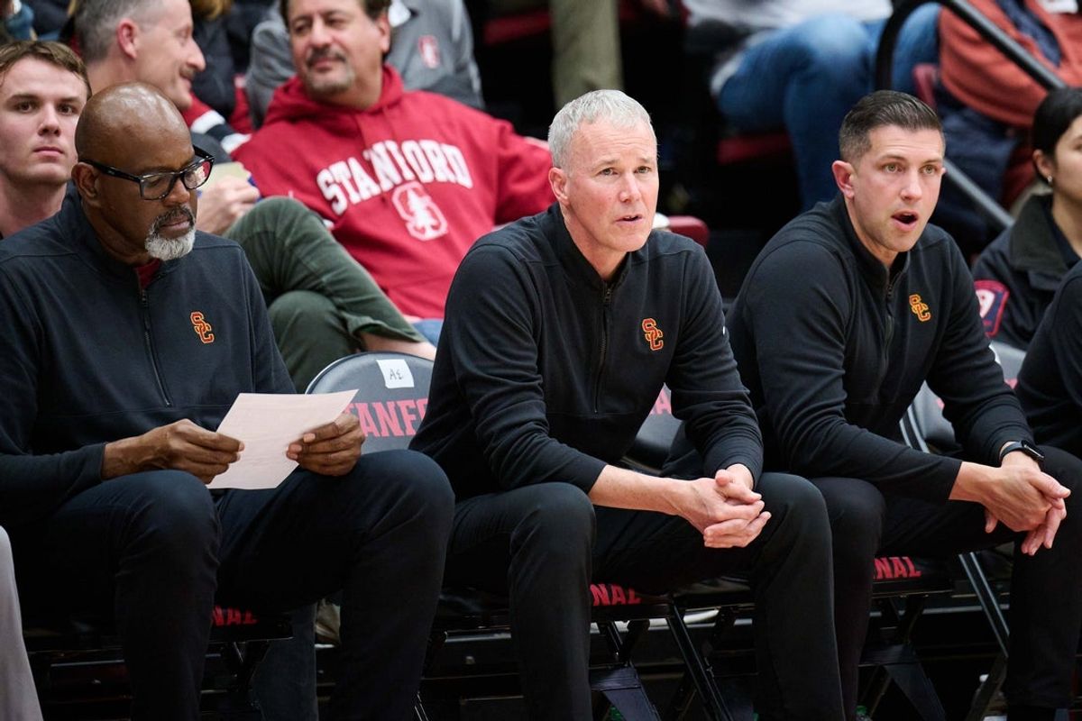 Feb 10, 2024; Stanford, California, USA; USC Trojans head coach Andy Enfield (center) and assistant coach Eric Mobley (left) and associate head coach Chris Capko during the second half against the Stanford Cardinal at Maples Pavilion. Mandatory Credit: Robert Edwards-Imagn Images