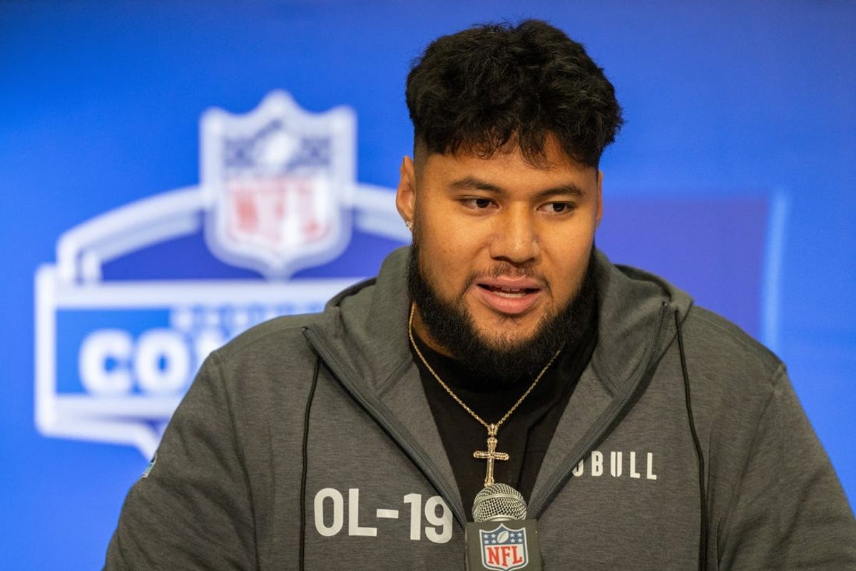 Mar 2, 2024; Indianapolis, IN, USA; Washington offensive lineman Troy Fautanu (OL19) talks to the media during the 2024 NFL Combine at Lucas Oil Stadium. Mandatory Credit: Trevor Ruszkowski-USA TODAY Sports