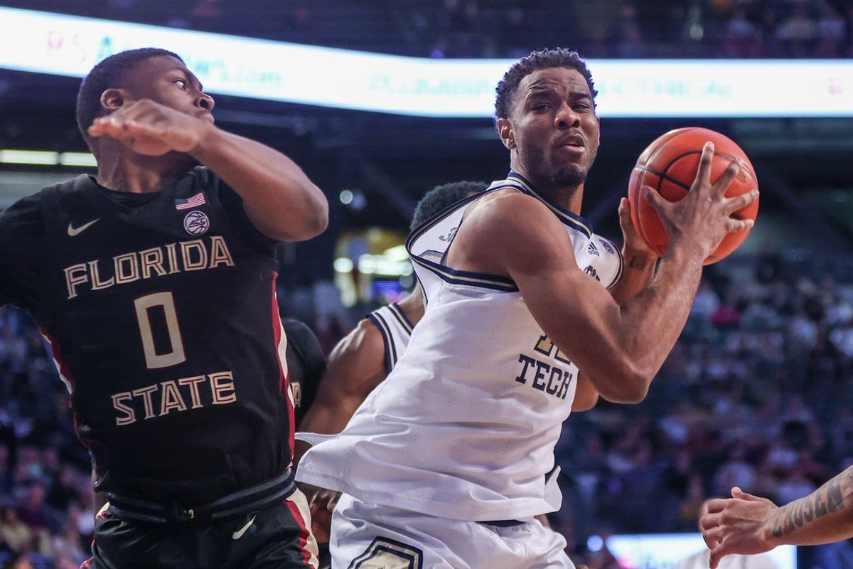 Mar 2, 2024; Atlanta, Georgia, USA; Georgia Tech Yellow Jackets forward Tyzhaun Claude (12) grabs a rebound past Florida State Seminoles guard Chandler Jackson (0) in the second half at McCamish Pavilion. Mandatory Credit: Brett Davis-USA TODAY Sports