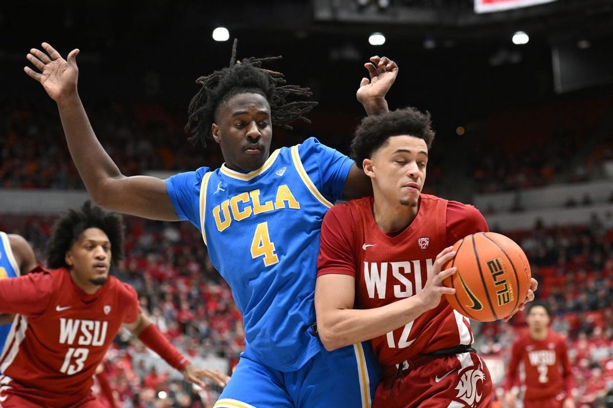 Mar 2, 2024; Pullman, Washington, USA; Washington State Cougars guard Isaiah Watts (12) controls the ball against UCLA Bruins guard Will McClendon (4) in the first half at Friel Court at Beasley Coliseum. Mandatory Credit: James Snook-USA TODAY Sports