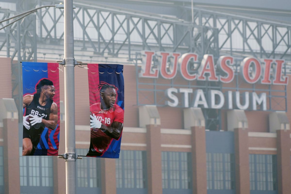 Banners featuring images of running back Bijan Robinson (left) and receiver Zay Flowers at the 2024 NFL Scouting Combine at Lucas Oil Stadium. Mandatory Credit: Kirby Lee-Imagn Images
