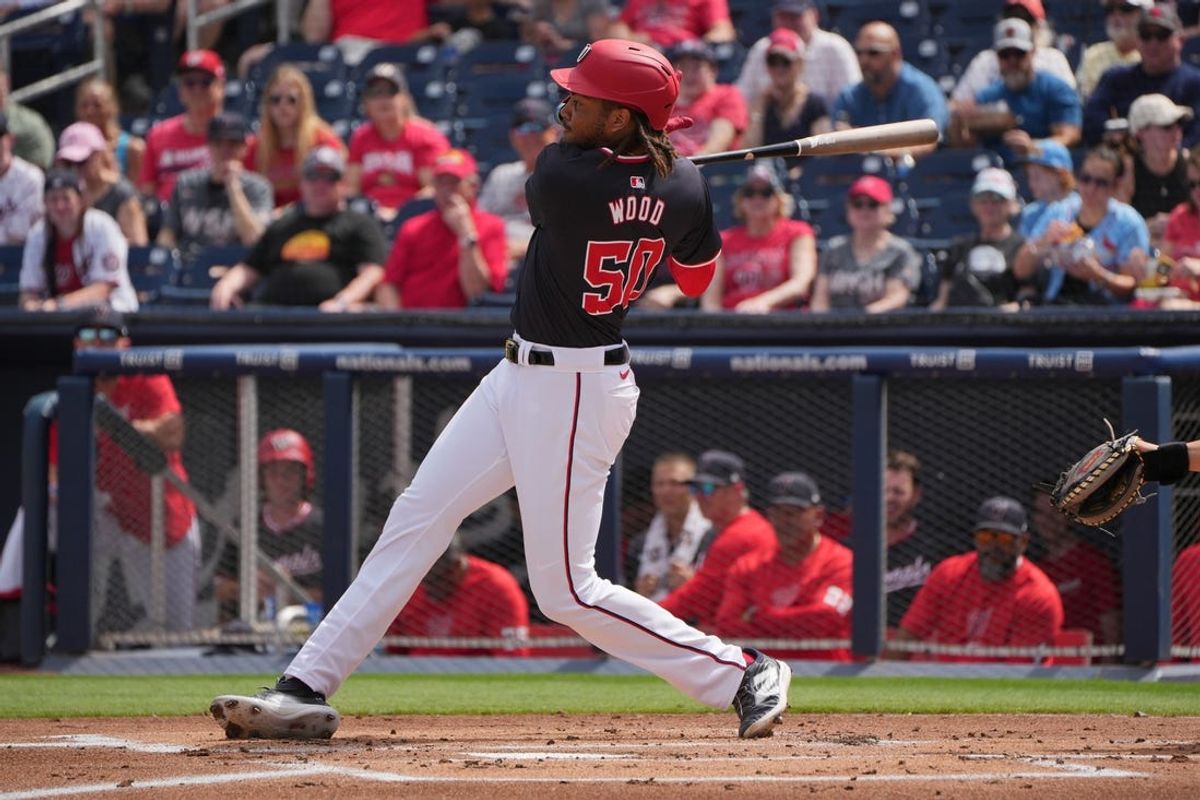 Mar 4, 2024; West Palm Beach, Florida, USA; Washington Nationals outfielder James Wood (50) hits a single in the first inning against the St. Louis Cardinals at CACTI Ballpark of the Palm Beaches. Mandatory Credit: Jim Rassol-USA TODAY Sports