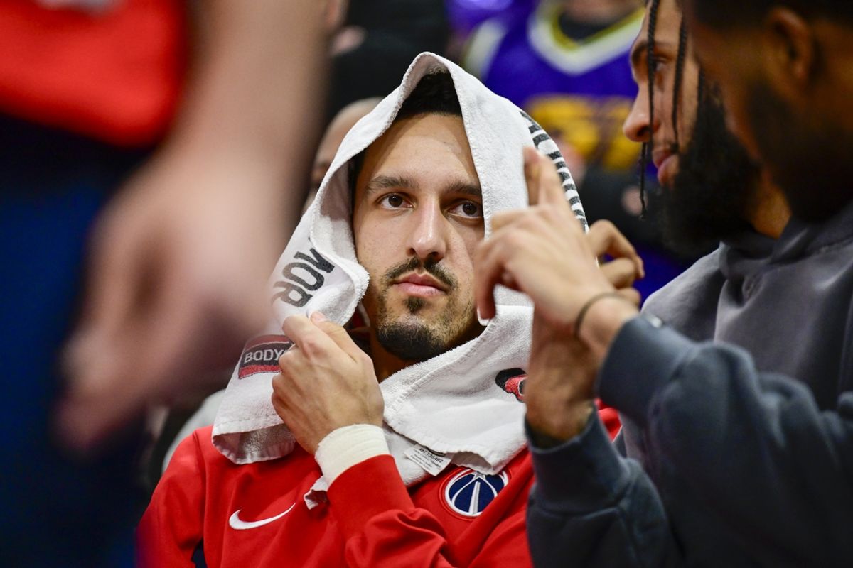 Mar 4, 2024; Salt Lake City, Utah, USA; Washington Wizards guard Landry Shamet (20) on the bench with a towel over his head against the Utah Jazz during the second half at the Delta Center. Mandatory Credit: Christopher Creveling-Imagn Images