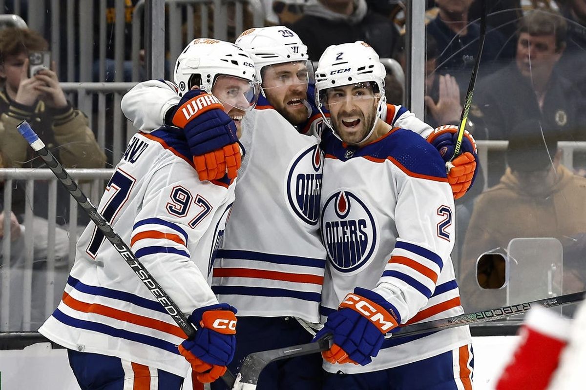 Mar 5, 2024; Boston, Massachusetts, USA; Edmonton Oilers center Leon Draisaitl (29) celebrates his game winning overtime goal against the Boston Bruins with teammates center Connor McDavid (97) and defenseman Evan Bouchard (2) at TD Garden. Mandatory Credit: Winslow Townson-USA TODAY Sports