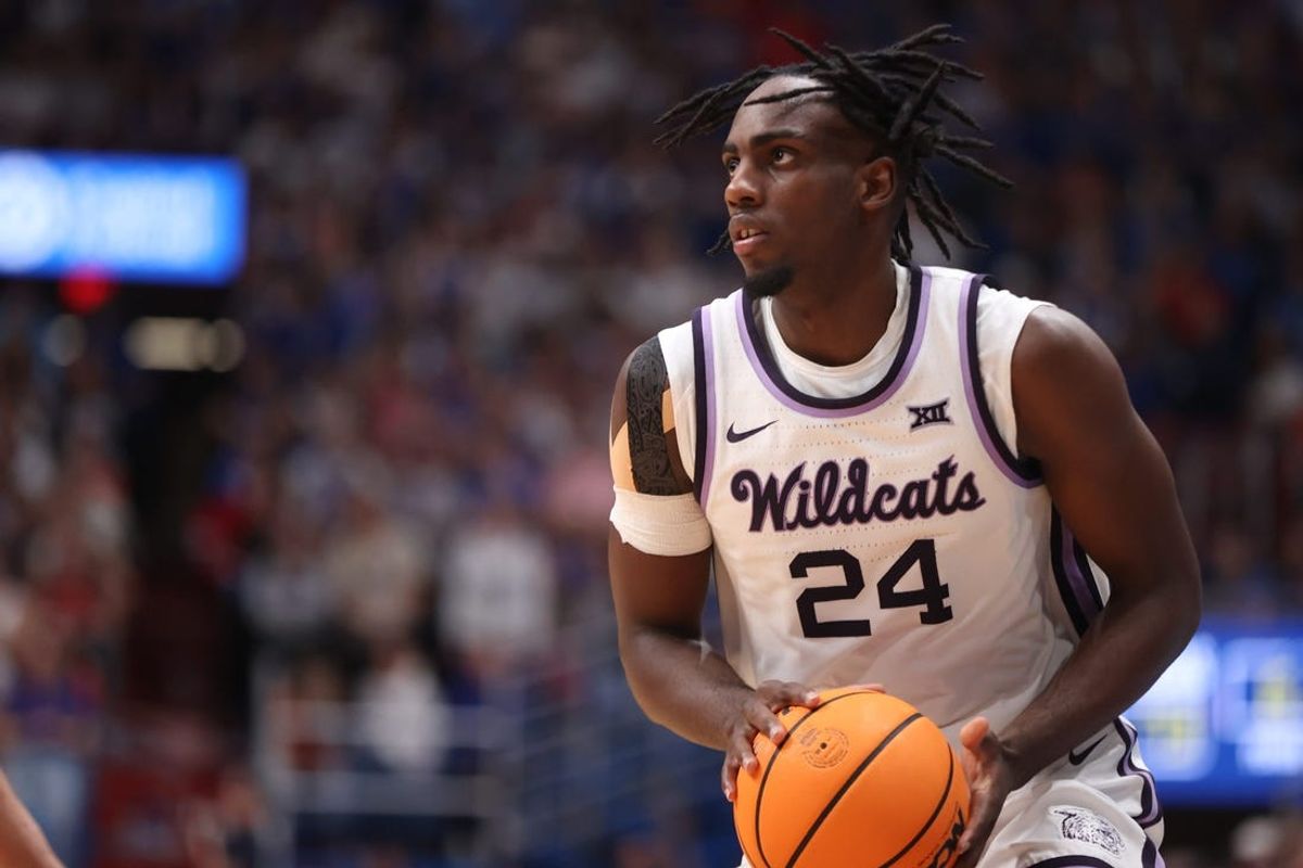 Kansas State junior forward Arthur Kaluma (24) looks for an open pass in the second half of the Sunflower Showdown inside Allen Fieldhouse Tuesday, March 5, 2024.