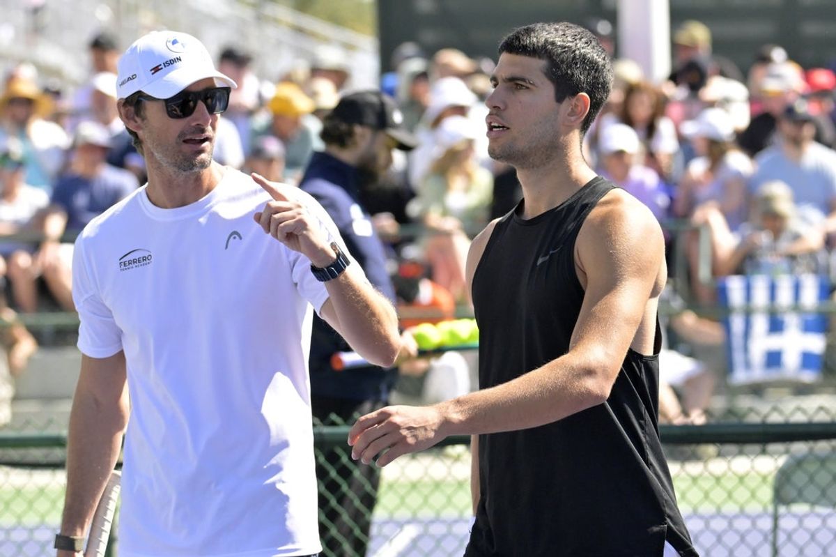 Mar 6, 2024; Indian Wells, CA, USA;  Tennis coach Juan Carlos Ferrero talks with Carlos Alcaraz (ESP) on the practice courts during the BNP Paribas Open at the Indian Wells Tennis Garden. Mandatory Credit: Jayne Kamin-Oncea-Imagn Images