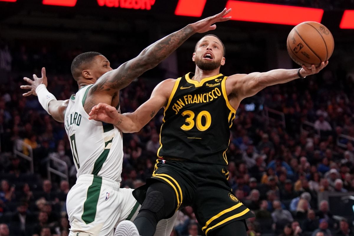 Mar 6, 2024; San Francisco, California, USA; Golden State Warriors guard Stephen Curry (30) shoots the ball while being defended by Milwaukee Bucks guard Damian Lillard (0) in the third quarter at the Chase Center. Mandatory Credit: Cary Edmondson-Imagn Images