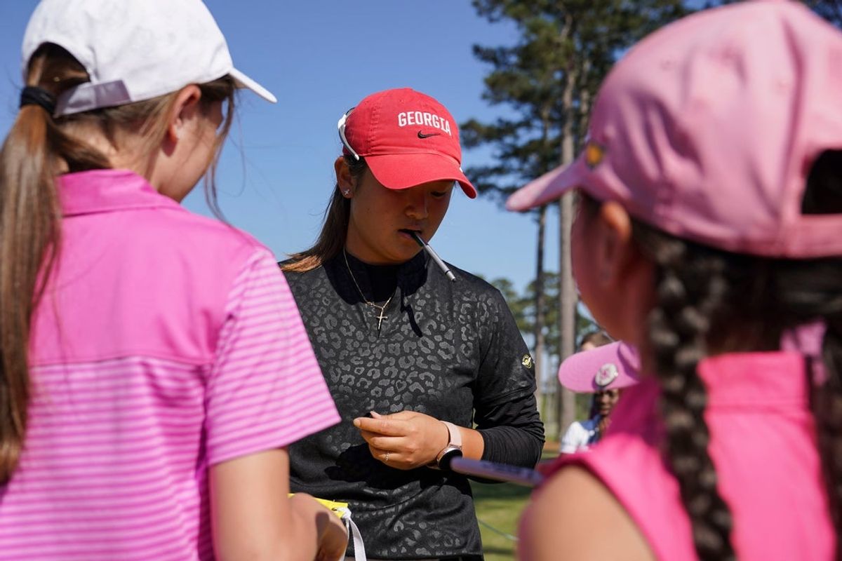Jenny Bae, of Ga., signs autographs after the second round of The Augusta National Women's Amateur at Champions Retreat in Augusta, Ga., on Thursday, March 30, 2023. Bae is in third at -7.