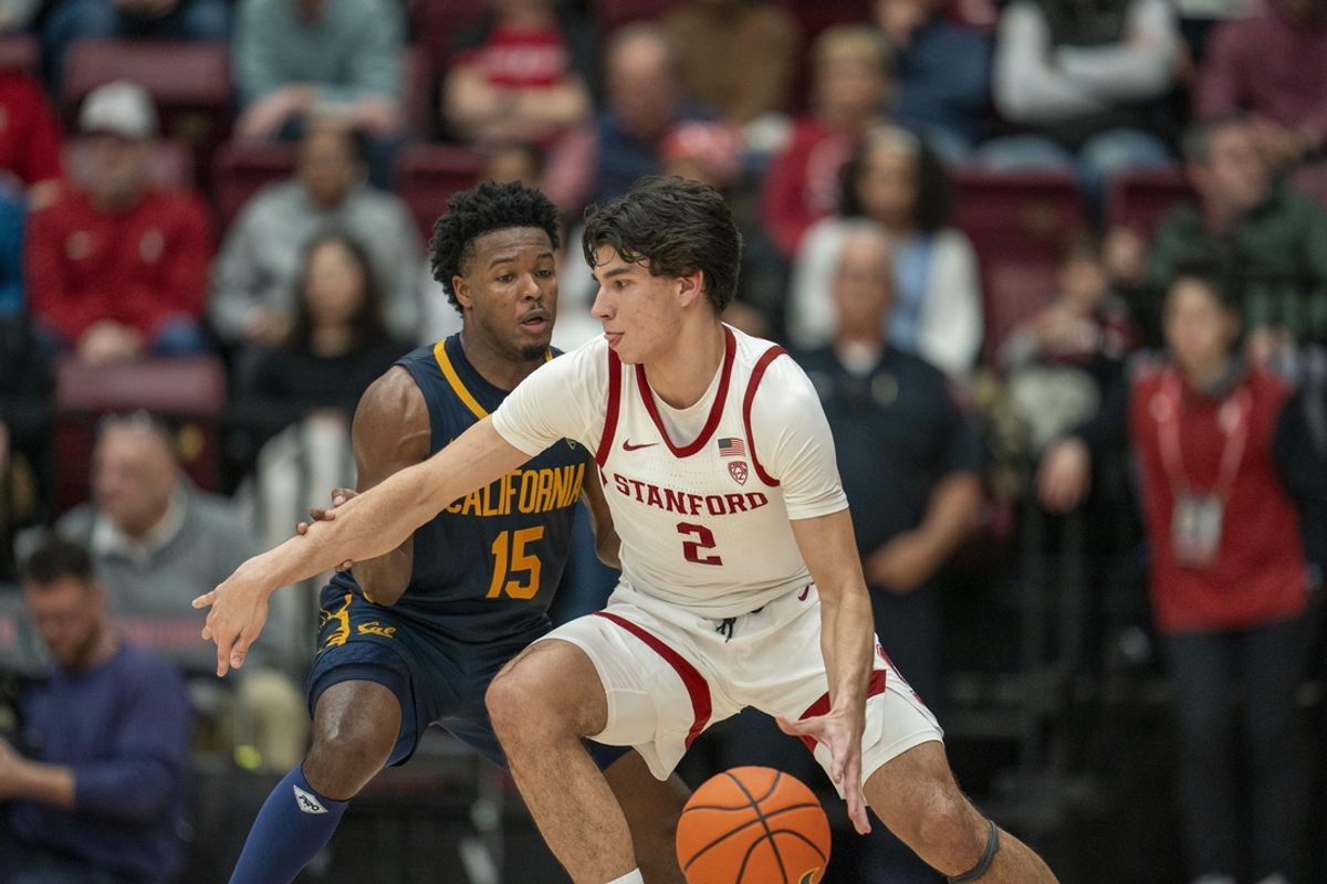 Mar 7, 2024; Stanford, California, USA; California Golden Bears guard Jalen Cone (15) defends against Stanford Cardinal guard Andrej Stojakovic (2) during the second half at Maples Pavillion. Mandatory Credit: Neville E. Guard-Imagn Images